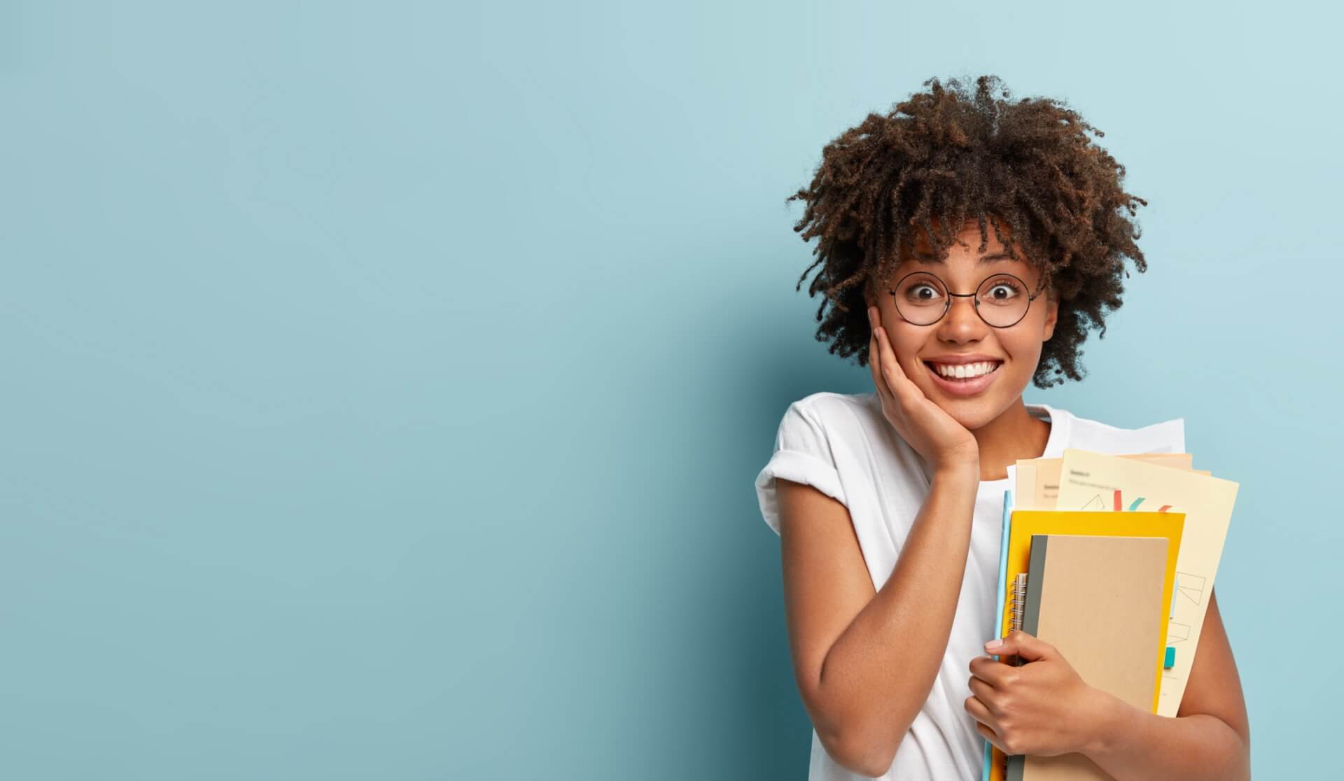 Pleasant Looking Afro American Woman Holds Notepads Papers Studies College Glad Finish Studying